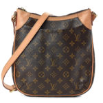 This stylish messenger bag is crafted of signature Louis Vuitton monogram coated canvas